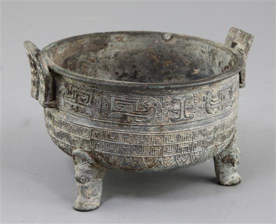 A Chinese archaic bronze tripod food vessel, Ding, probably Warring States period, 5th-2nd century B.C., 14.5cm, 9.5cm high, repair